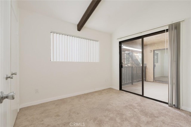 carpeted empty room with lofted ceiling with beams