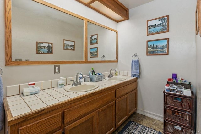 bathroom with vanity and tile patterned flooring