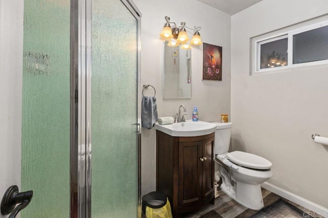 bathroom with toilet, a shower with door, wood-type flooring, a chandelier, and vanity