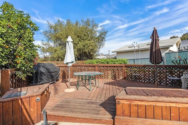 wooden deck with grilling area