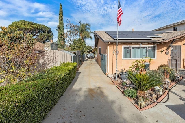 view of home's exterior with solar panels