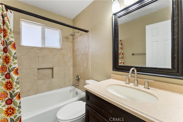 bathroom with toilet, shower / bath combo, and vanity