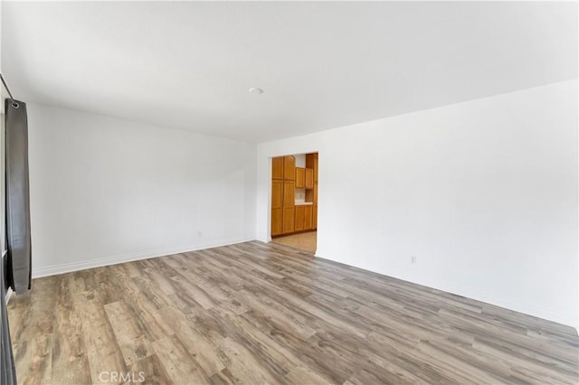 unfurnished room featuring light hardwood / wood-style floors