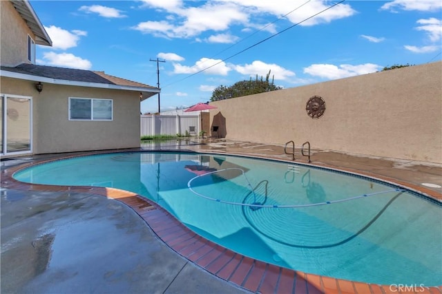 view of pool featuring a fenced backyard and a fenced in pool