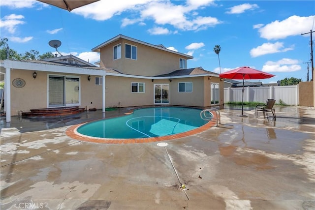 view of pool featuring a patio area, fence, and a fenced in pool