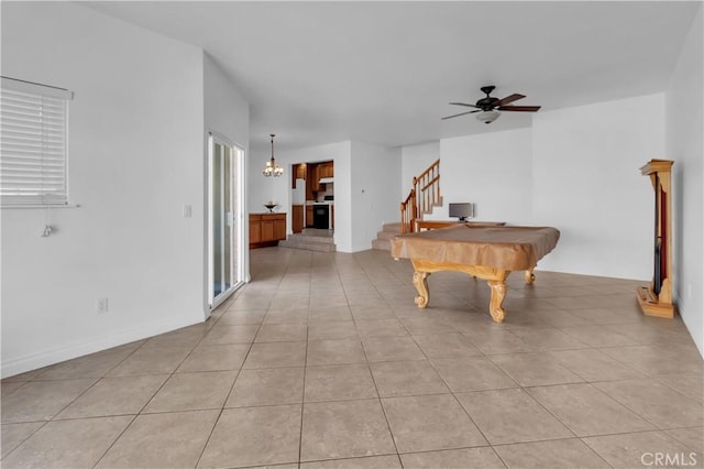 game room with pool table, a ceiling fan, and light tile patterned flooring