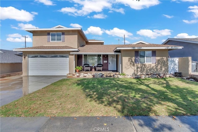 view of front of house featuring a front yard, concrete driveway, an attached garage, and stucco siding