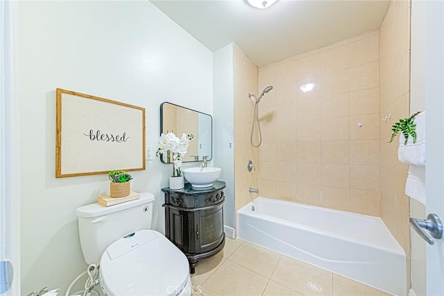 full bathroom featuring toilet, vanity, tiled shower / bath, and tile patterned flooring