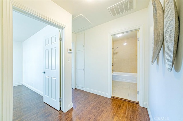 hallway featuring wood-type flooring