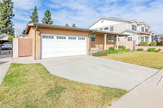 view of front of property with a garage and a front yard