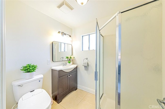 bathroom featuring walk in shower, vanity, tile patterned floors, and toilet