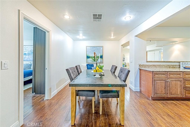 dining area with wood-type flooring