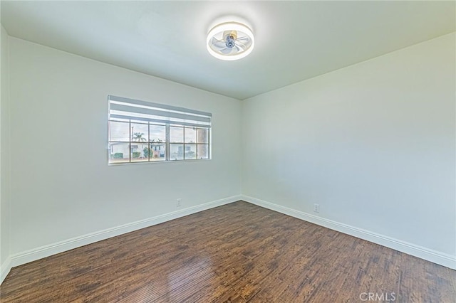 unfurnished room featuring dark hardwood / wood-style floors