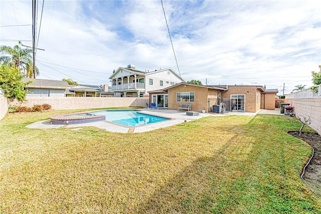 view of pool with central AC, an in ground hot tub, and a yard