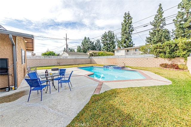 view of pool featuring a lawn and a patio