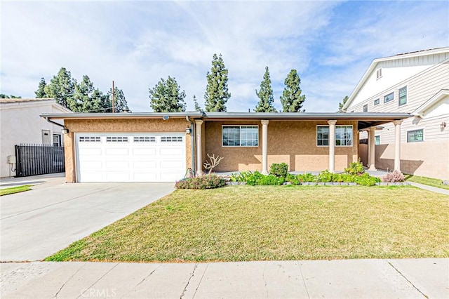 view of front of house with a front yard and a garage