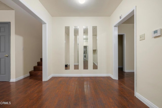 spare room featuring dark hardwood / wood-style flooring