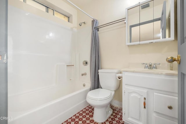 full bathroom featuring tile patterned flooring, shower / bath combo with shower curtain, vanity, and toilet