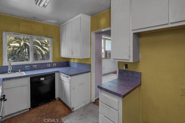 kitchen featuring sink, white cabinetry, and black dishwasher