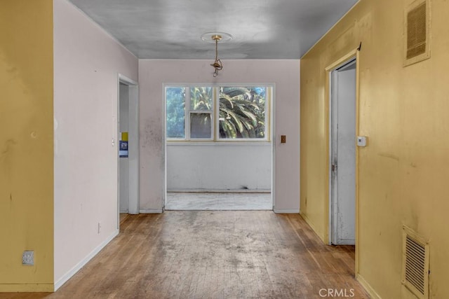 unfurnished dining area with hardwood / wood-style floors