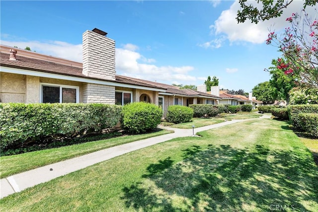 view of front of house with a front lawn