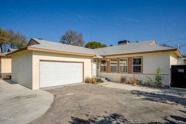 ranch-style home featuring a garage