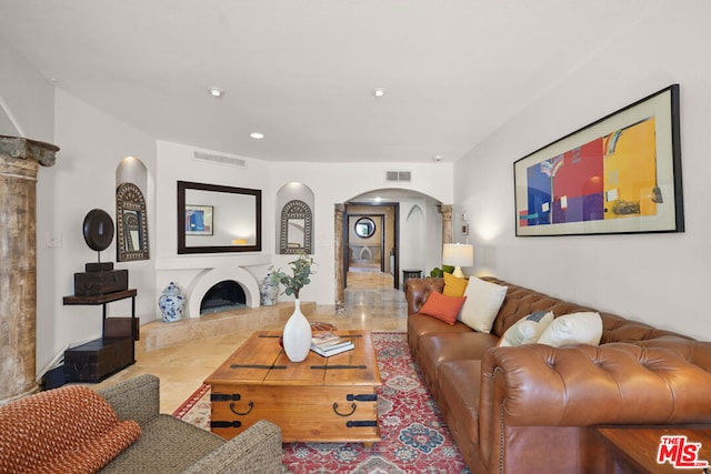 living room featuring a fireplace