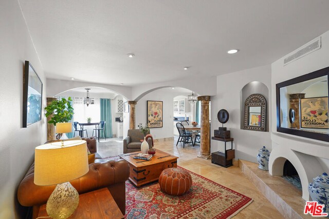 living room with a notable chandelier