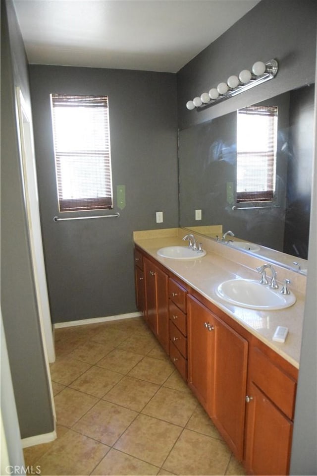 bathroom featuring vanity, a wealth of natural light, and tile patterned floors