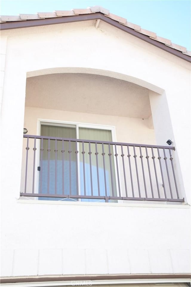 view of property exterior featuring a balcony