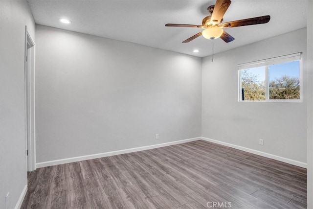 spare room featuring ceiling fan and hardwood / wood-style floors