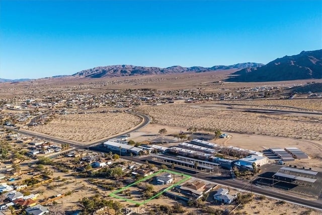 bird's eye view with a mountain view and view of desert