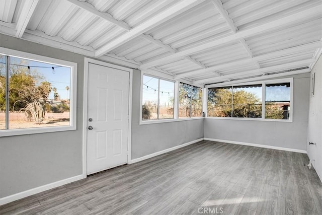 unfurnished sunroom featuring a healthy amount of sunlight