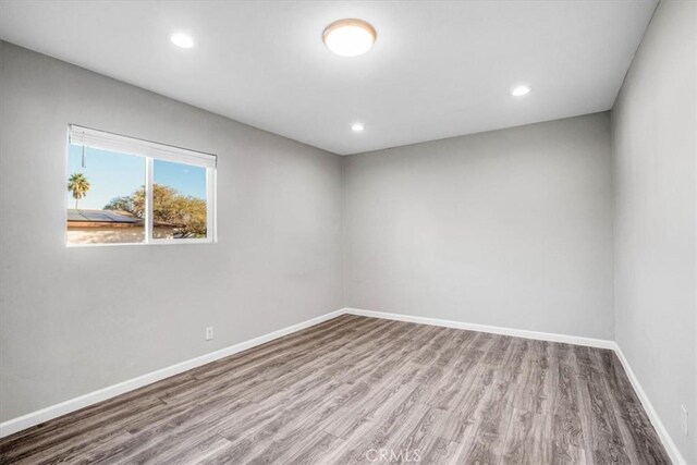 unfurnished room with light wood-type flooring