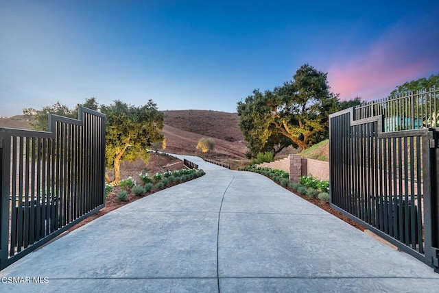 view of gate at dusk