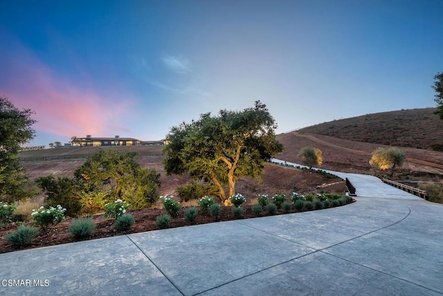 yard at dusk with a mountain view