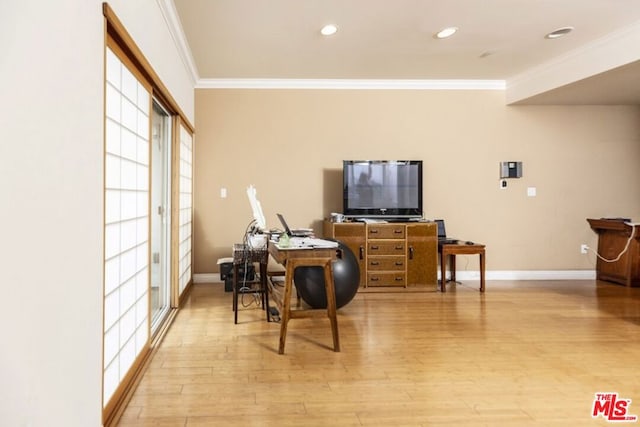 office area with light hardwood / wood-style flooring and ornamental molding