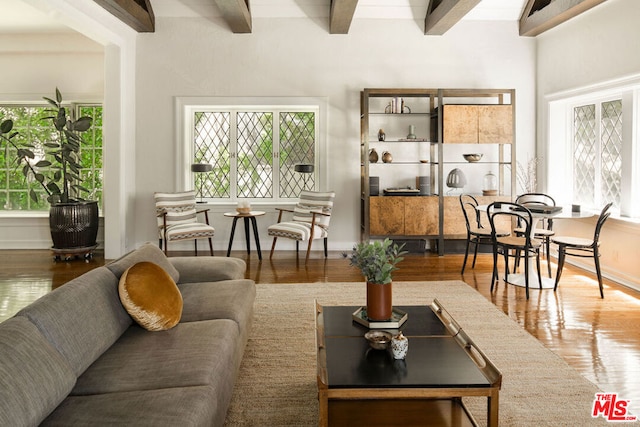 living room with beam ceiling and hardwood / wood-style flooring