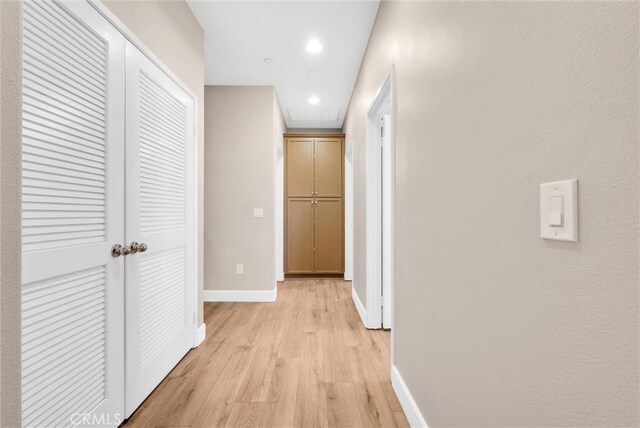 hall with light hardwood / wood-style floors