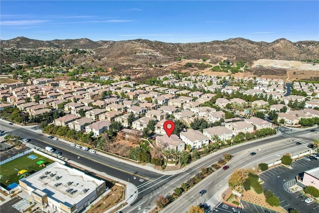 birds eye view of property with a mountain view