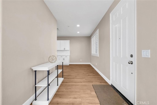 foyer entrance with light wood-type flooring