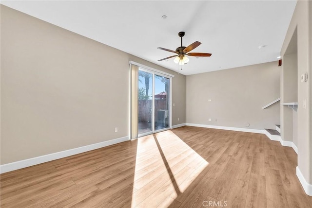 spare room with ceiling fan and light hardwood / wood-style flooring