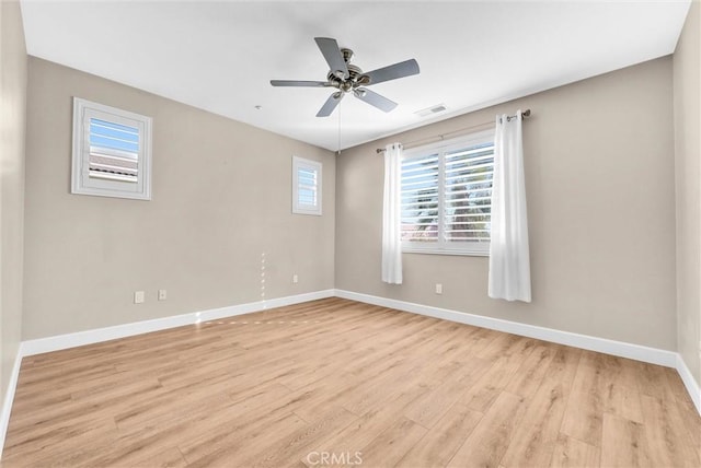 unfurnished room with ceiling fan and light wood-type flooring