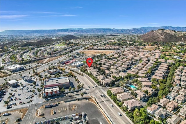 birds eye view of property with a mountain view