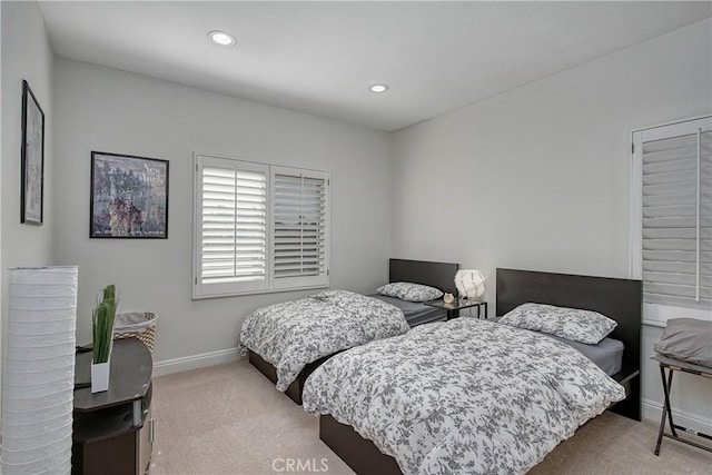 bedroom with light colored carpet