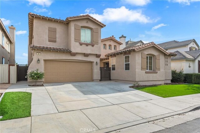 mediterranean / spanish-style home featuring a garage