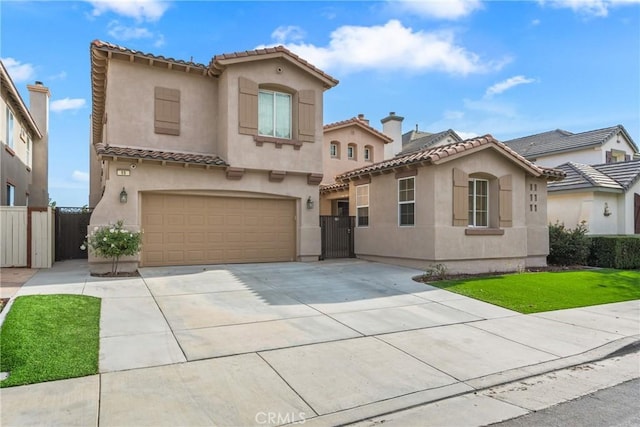 mediterranean / spanish house featuring a garage