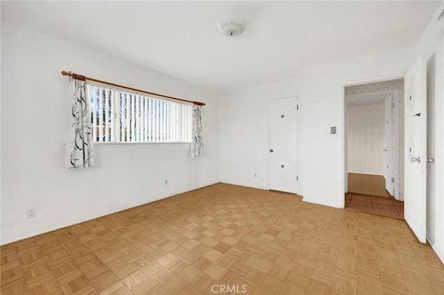 unfurnished bedroom with light parquet floors