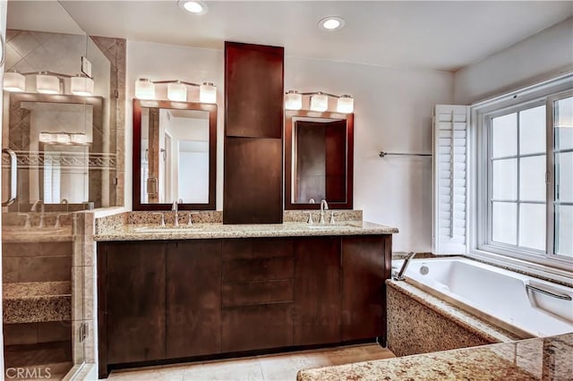 bathroom featuring vanity and plus walk in shower