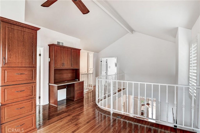 corridor with dark hardwood / wood-style flooring, high vaulted ceiling, and beam ceiling